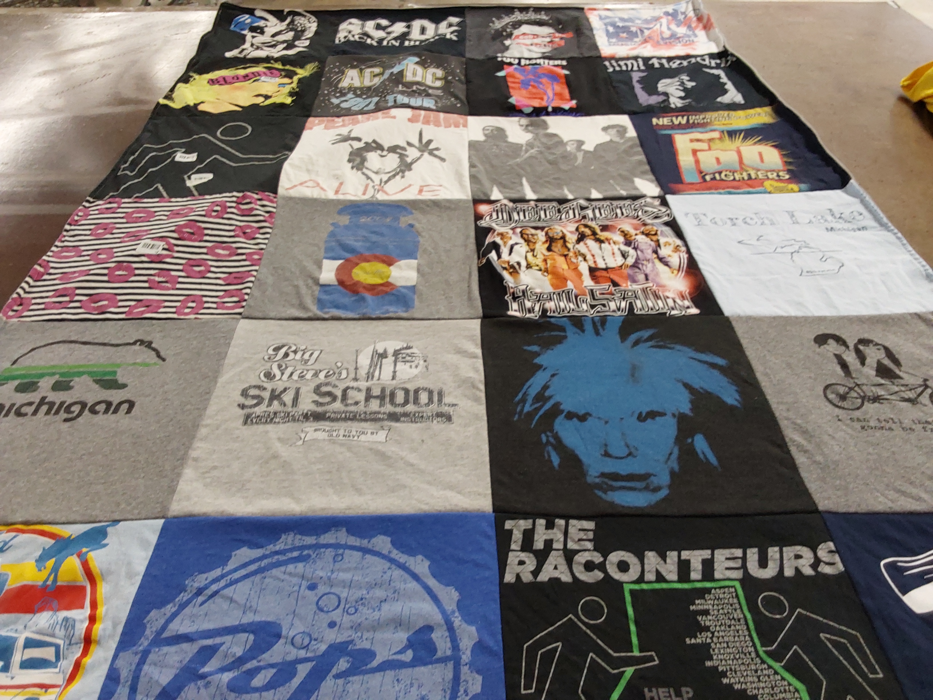 T-shirt quilt with music, skiing themes by Jennifer from NC