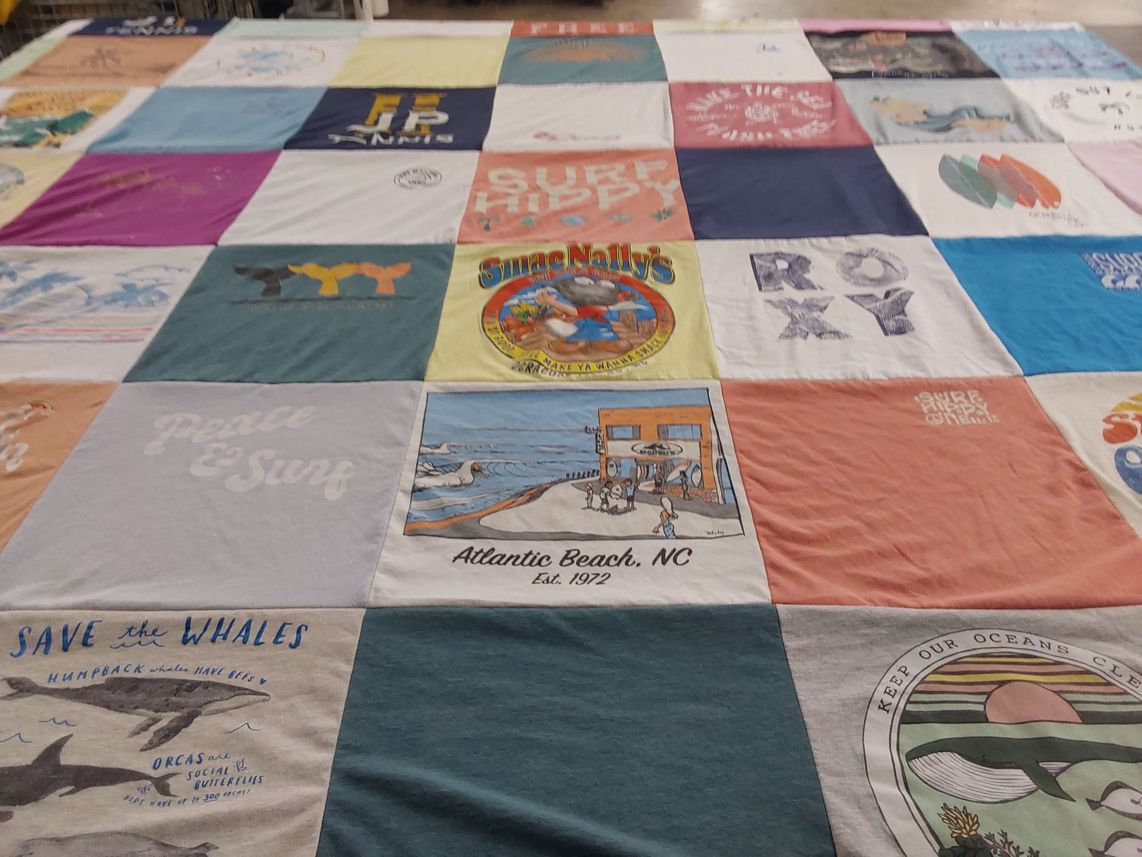 T-shirt quilt with surfing, ocean conservation themes by Michelle from NC