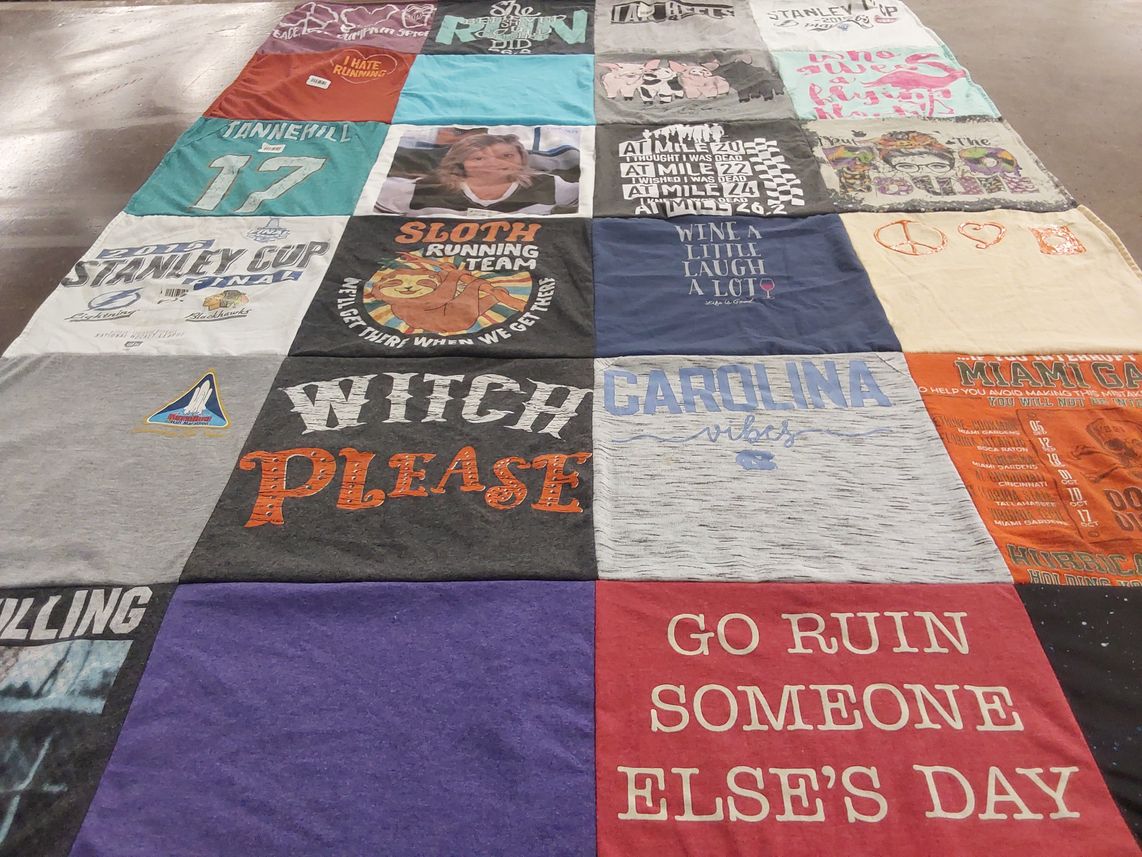 T-shirt quilt with running, sports themes by Leslie from FL