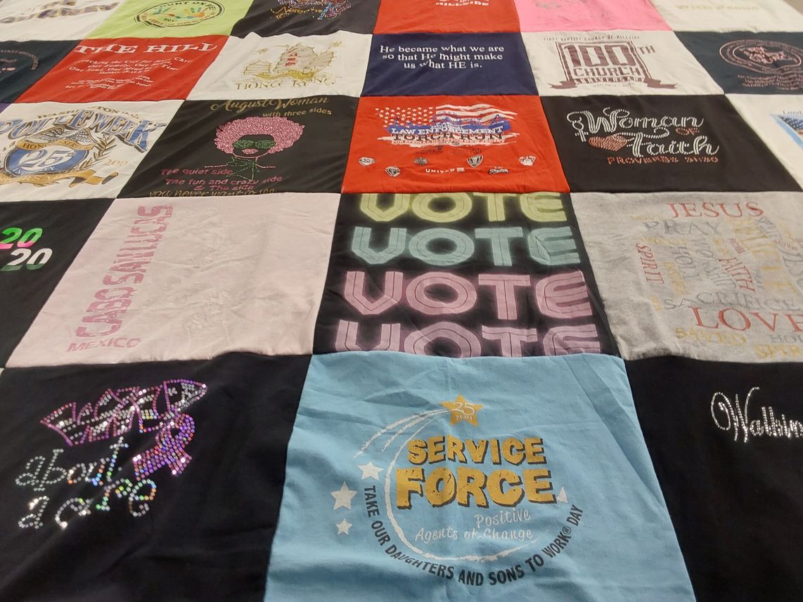 T-shirt quilt with community service, activism themes by Sandra from NJ