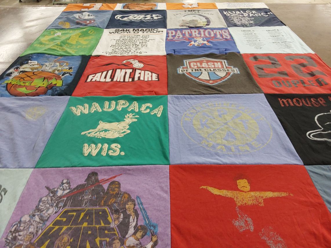 T-shirt quilt with sports, movies themes by Emily from ME