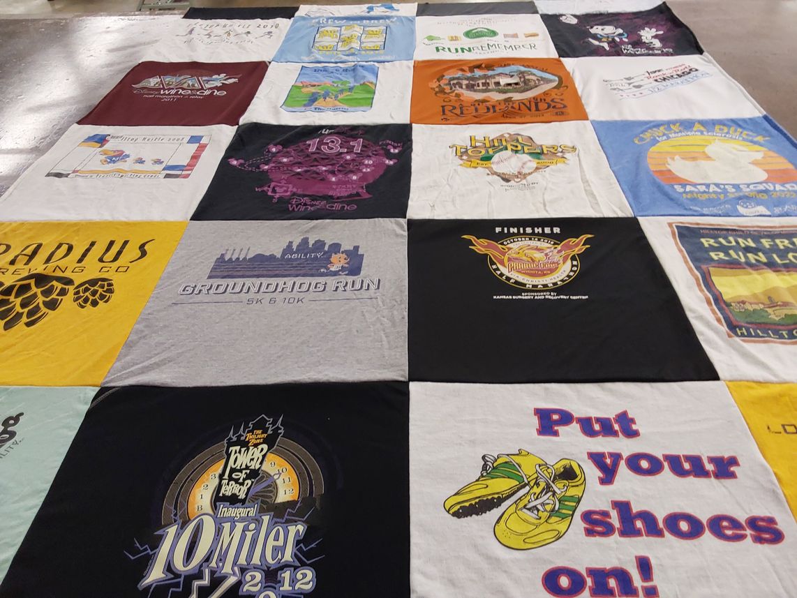 T-shirt quilt with running, events themes by Gina from KS