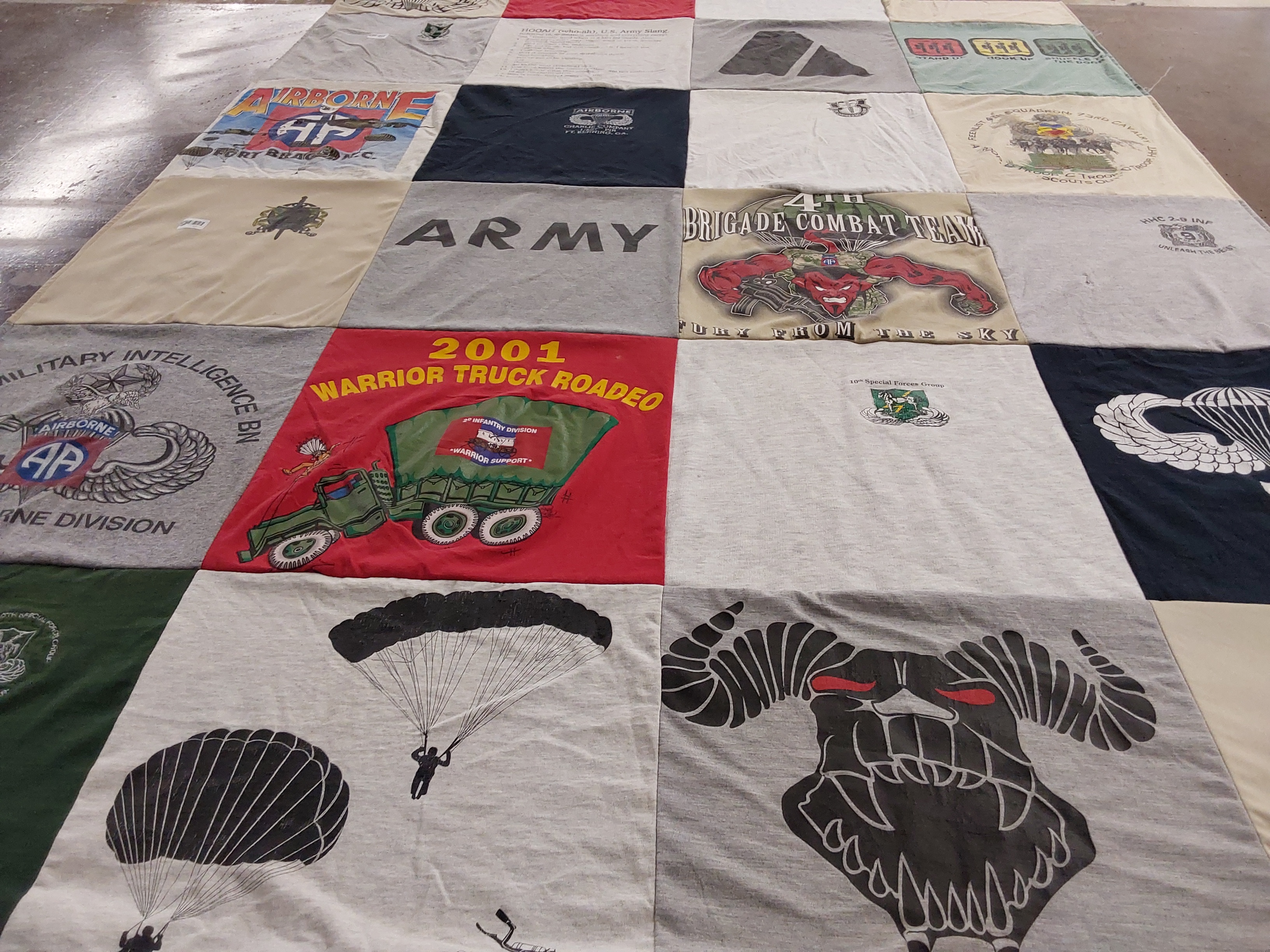 T-shirt quilt with military, parachuting themes by Teizel from NC