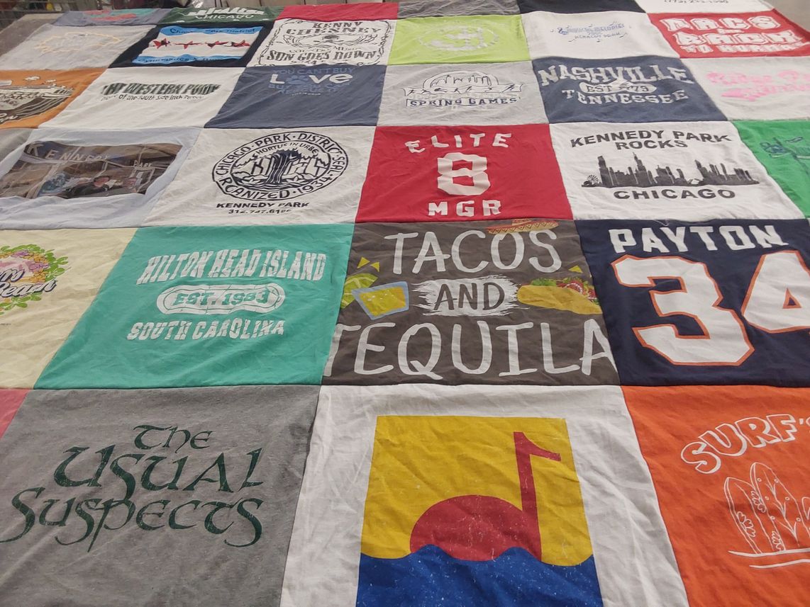 T-shirt quilt with travel, food themes by Jennifer M. from IL