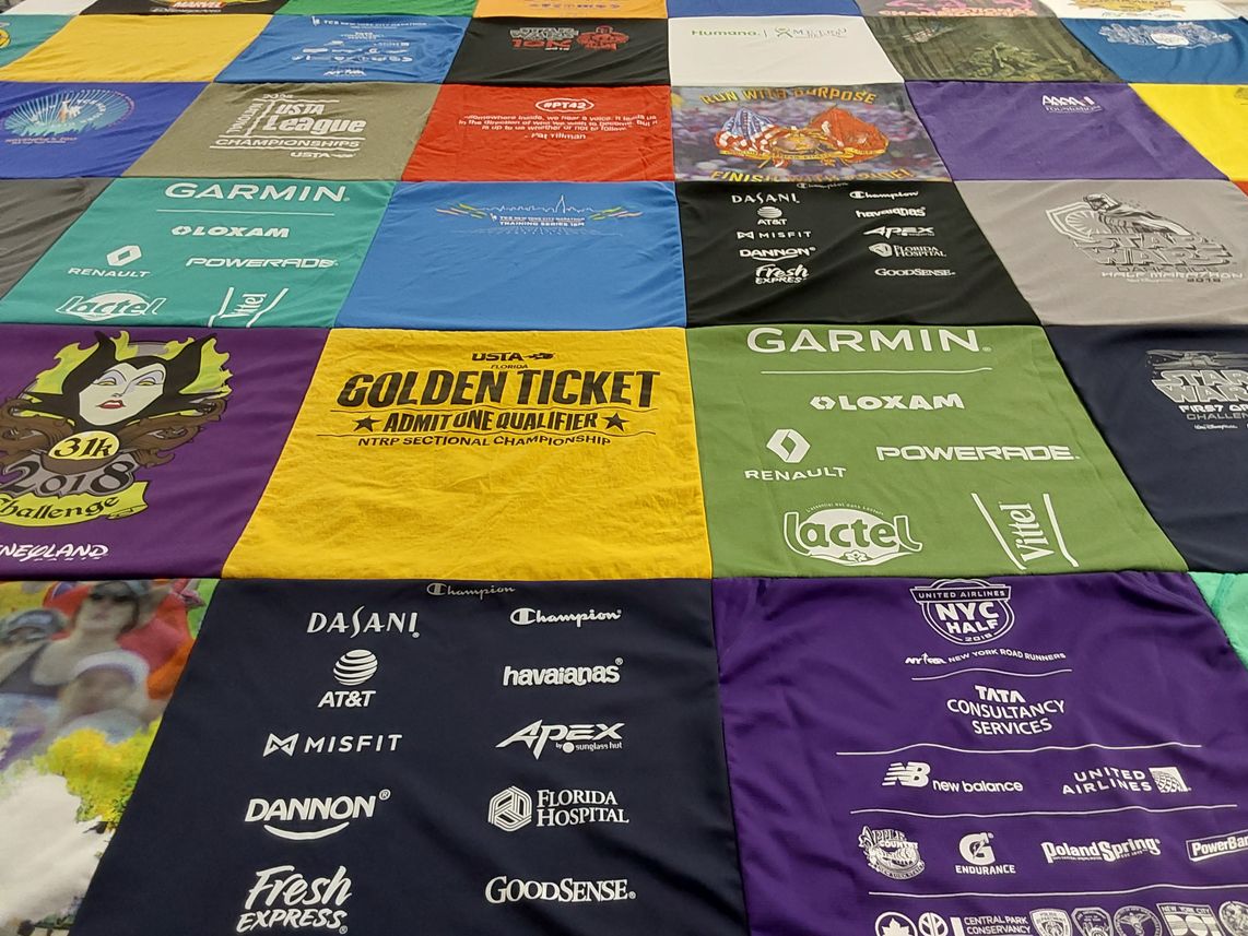 T-shirt quilt with running, sports themes by Maureen from FL