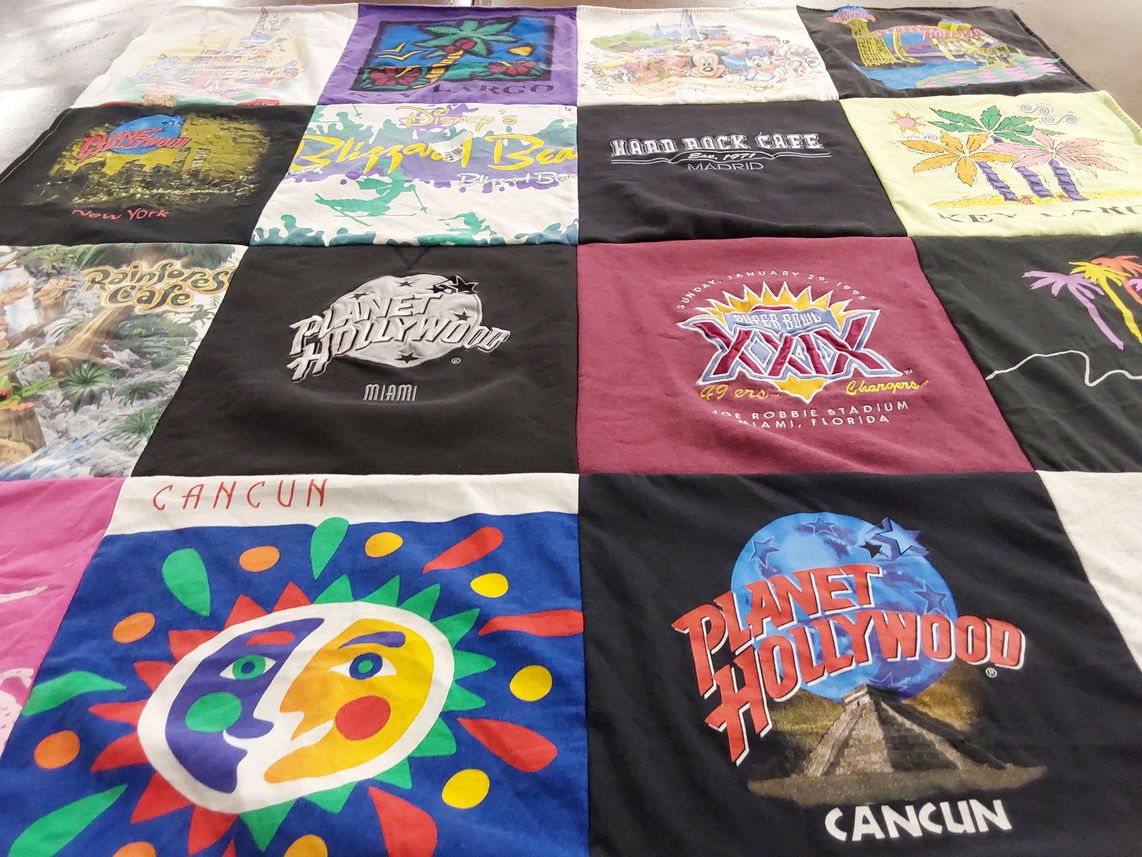 T-shirt quilt with travel, entertainment themes by Sandra from NY