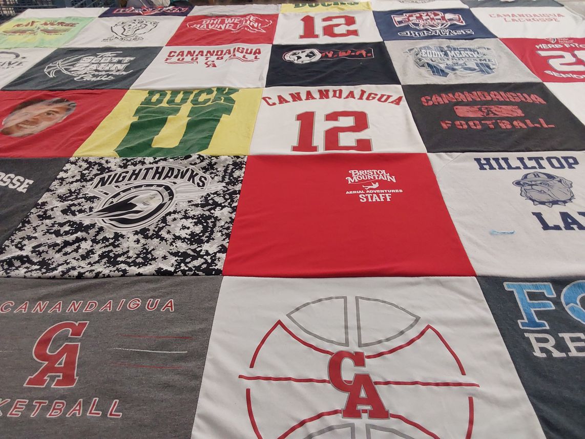 T-shirt quilt featuring canandaigua varsity basketball, canandaigua football by eRIN from NY