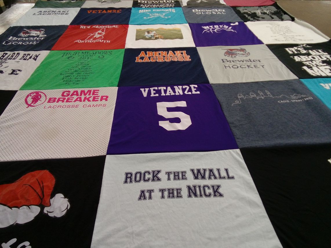 T-shirt quilt with lacrosse, hockey themes by Amanda from NH