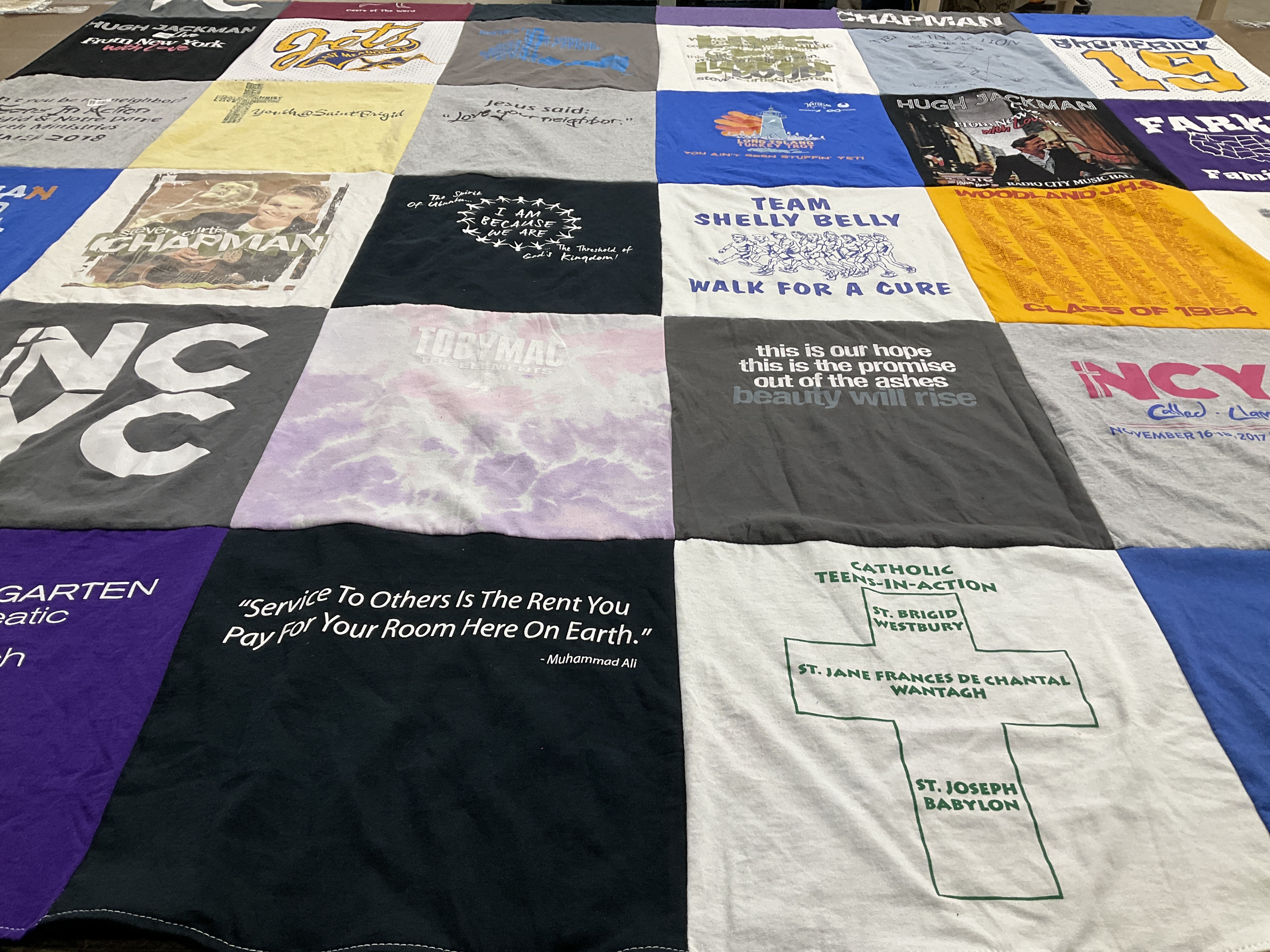 T-shirt quilt with charity, religion themes by Carolyn from NY