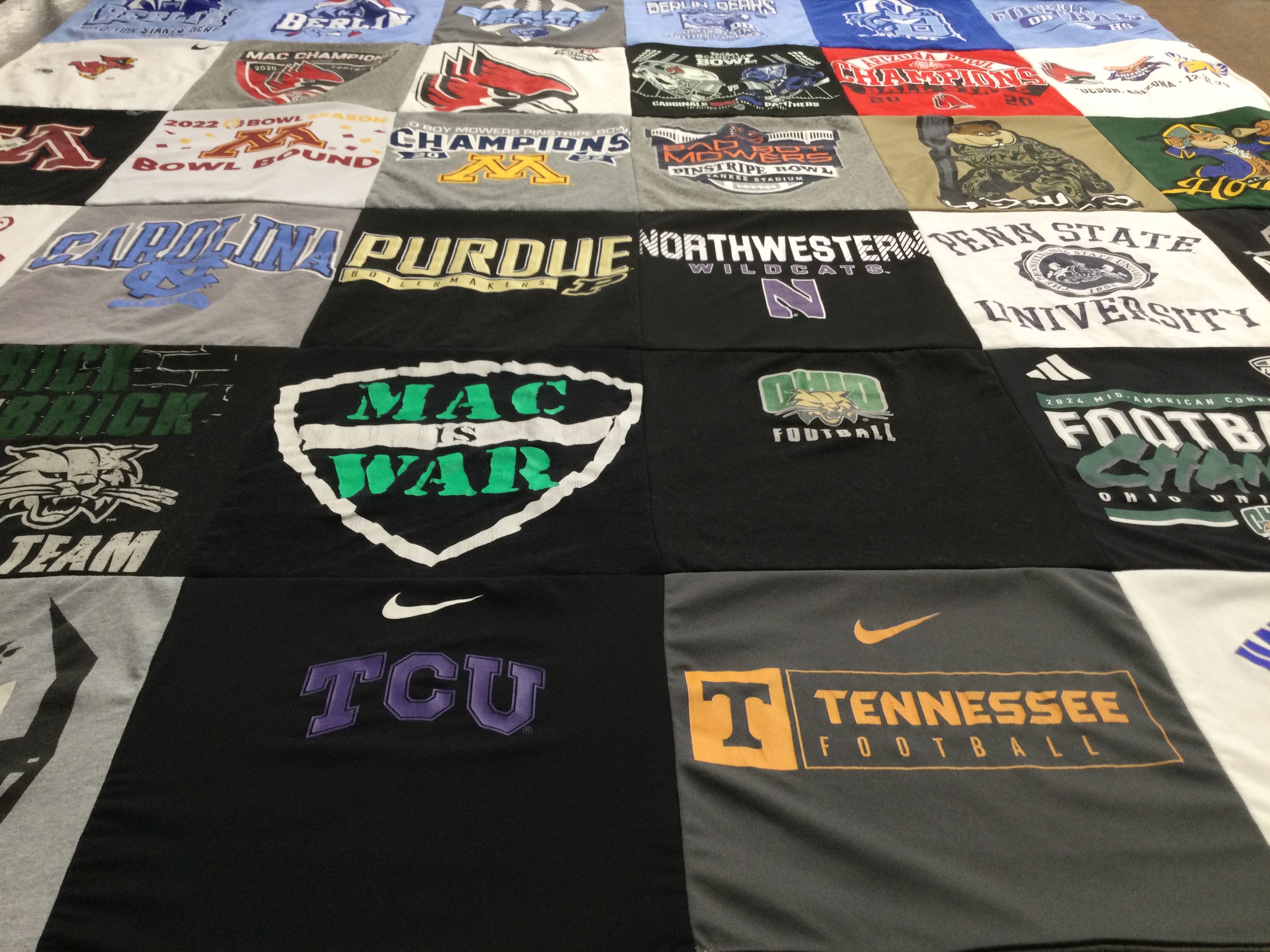 T-shirt quilt featuring tennessee volunteers football, northwestern wildcats football by Laura from OH