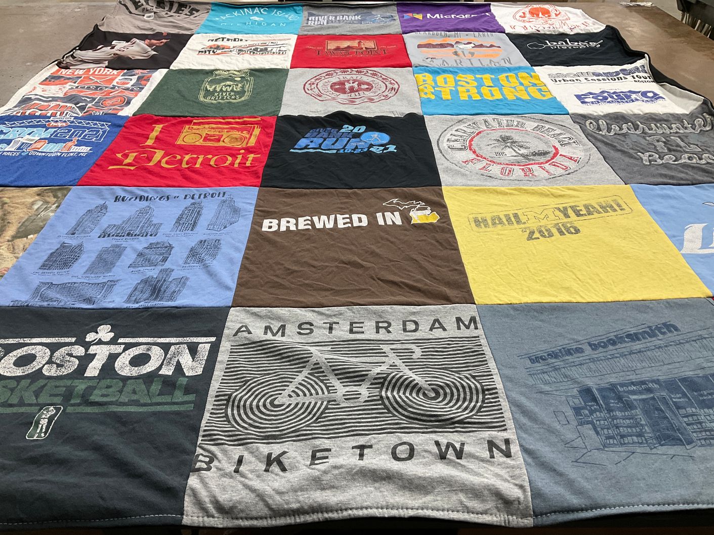 T-shirt quilt with music, travel themes by Madeline from MI
