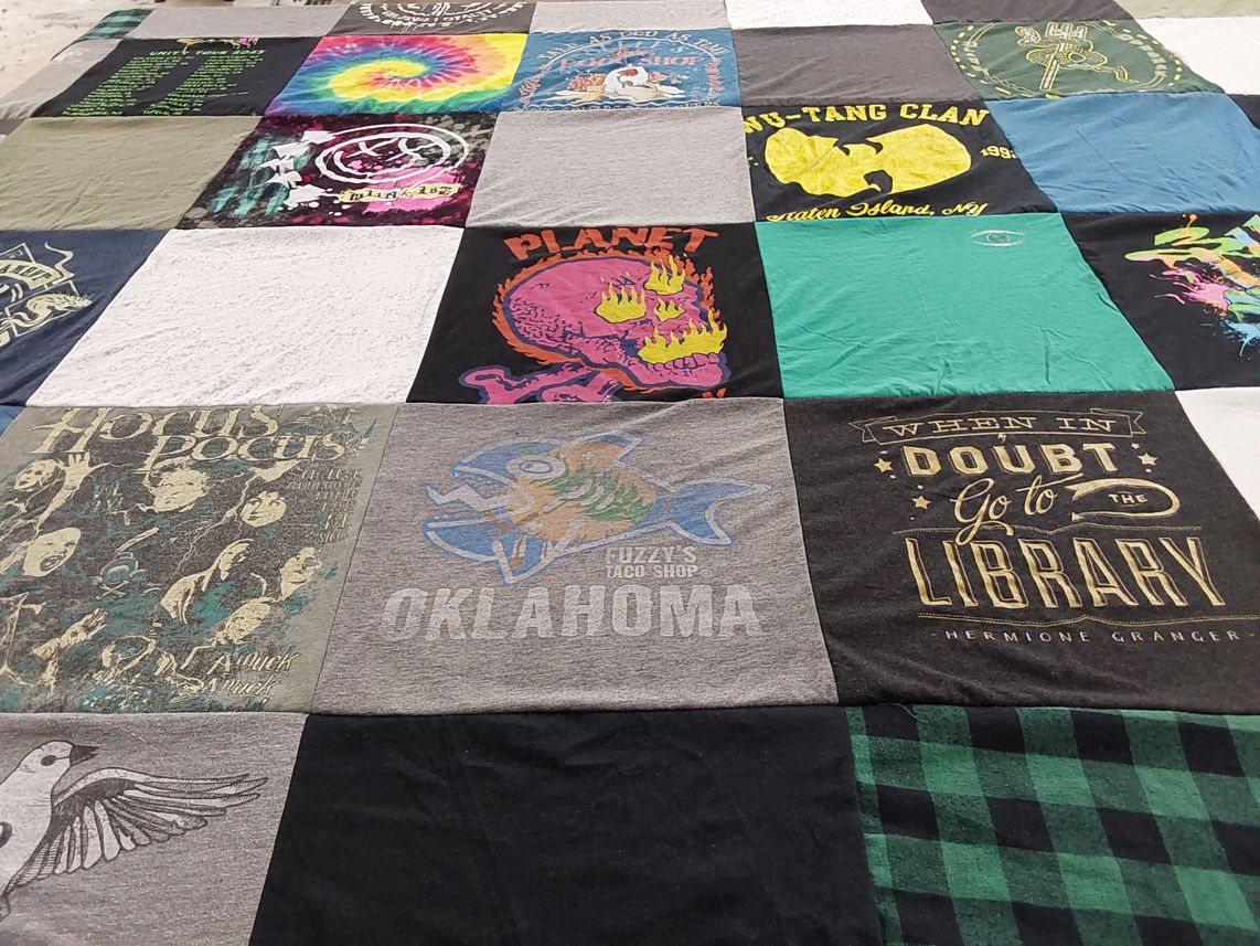 T-shirt quilt with music, literature themes by Megan from VA