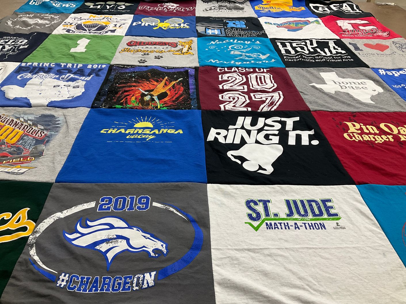 T-shirt quilt featuring pin oak chargers by Tonyamas from TX