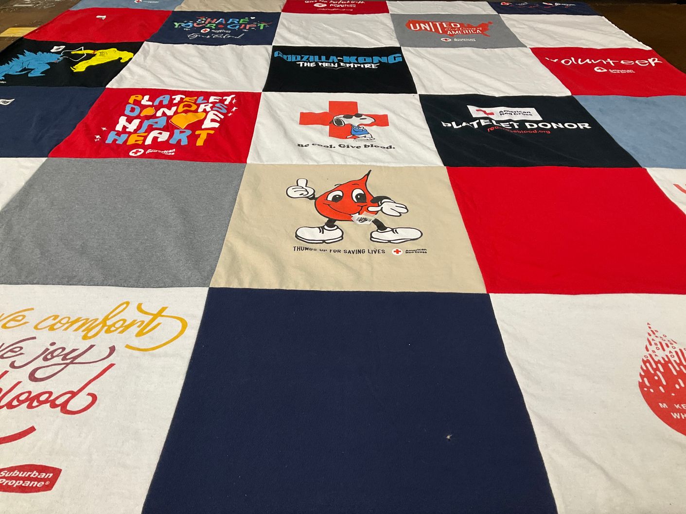 T-shirt quilt with blood donation, volunteering themes by Elizabeth from MA