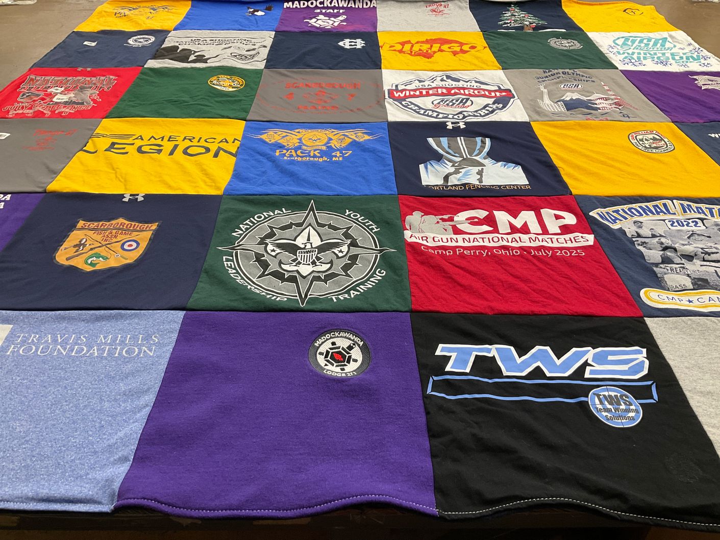 T-shirt quilt with fencing, shooting themes by Anne Marie from ME