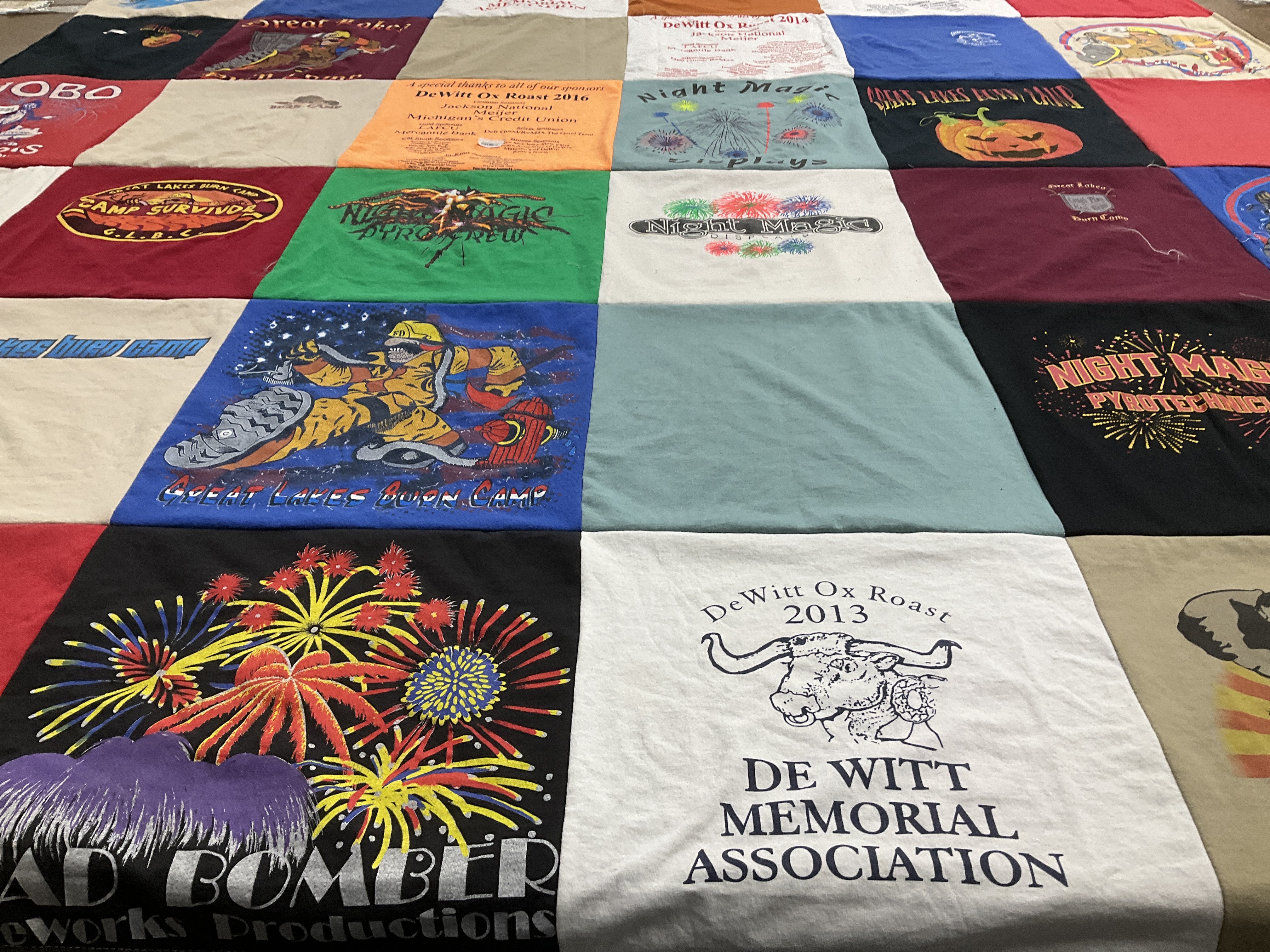 T-shirt quilt with camping, fireworks themes by Theresa from MI