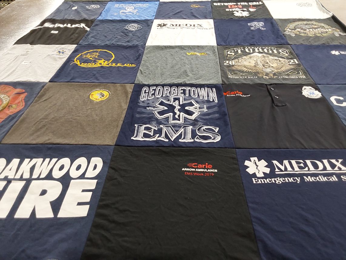 T-shirt quilt with emergency medical services, motorcycle rallies themes by Vicky from IL