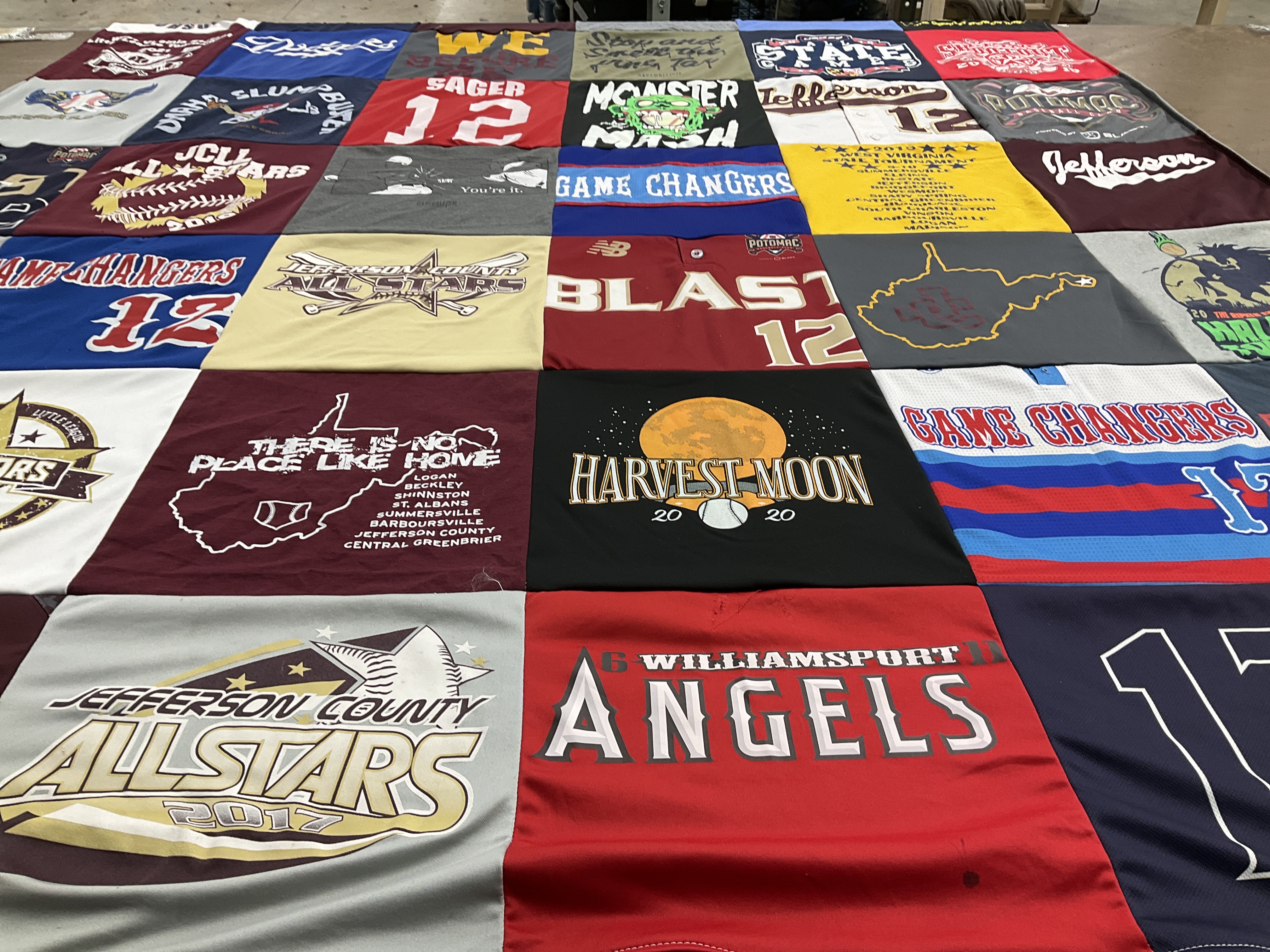 T-shirt quilt with sports, community themes by Martha from WV