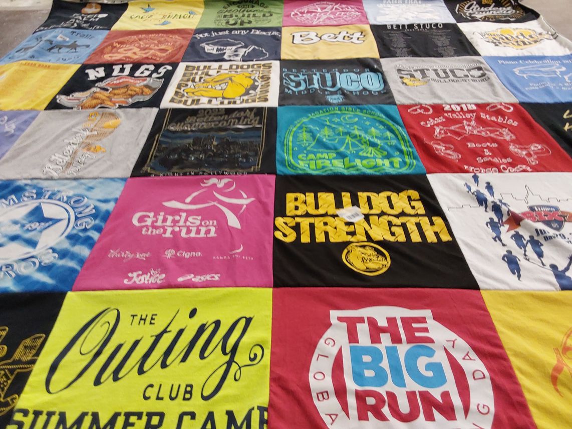 T-shirt quilt with running, strength training themes by Carrie from IA