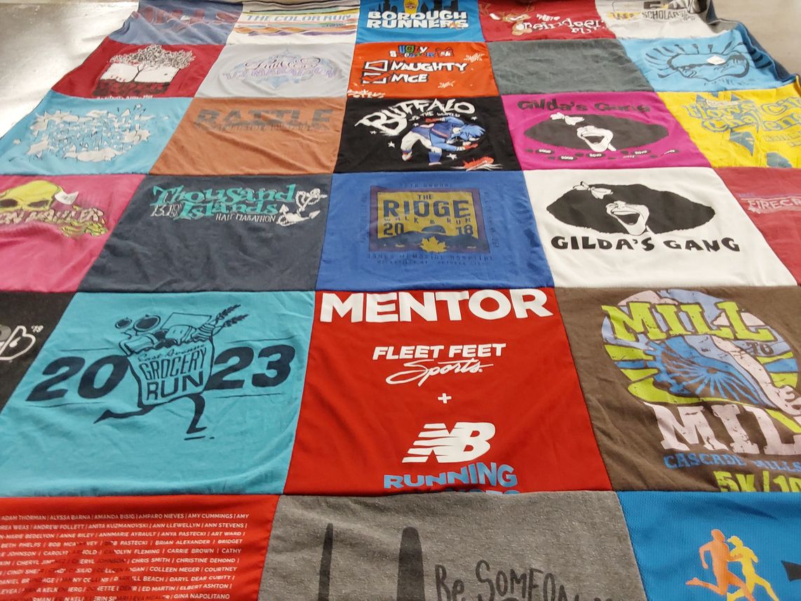 T-shirt quilt with running, sports themes by Kathleen from NY