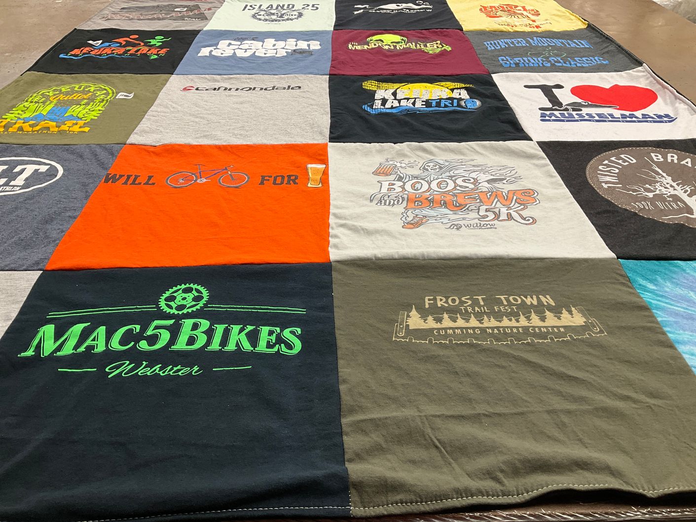T-shirt quilt with biking, running themes by Joan from NY