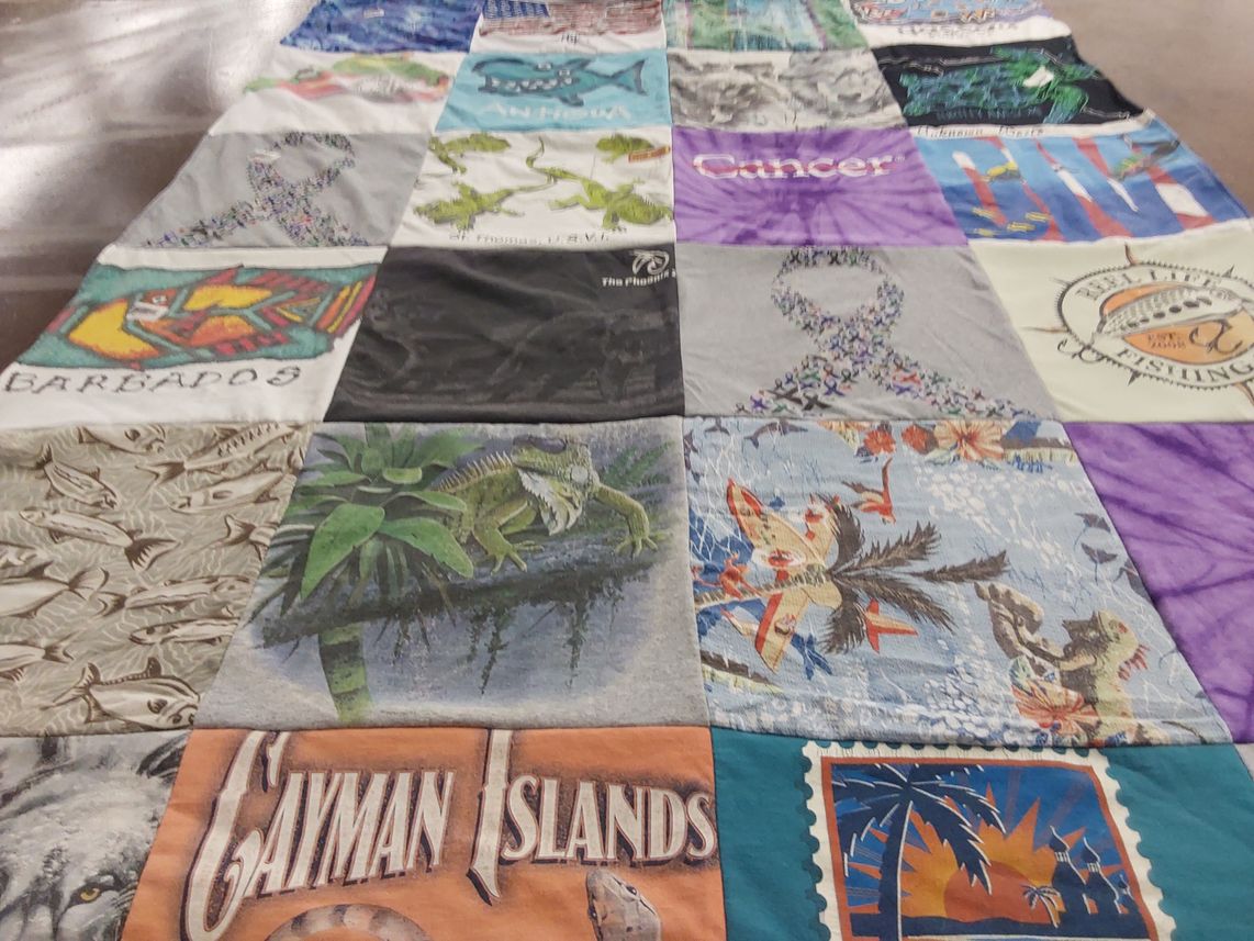 T-shirt quilt with fishing, travel themes by Terry from FL