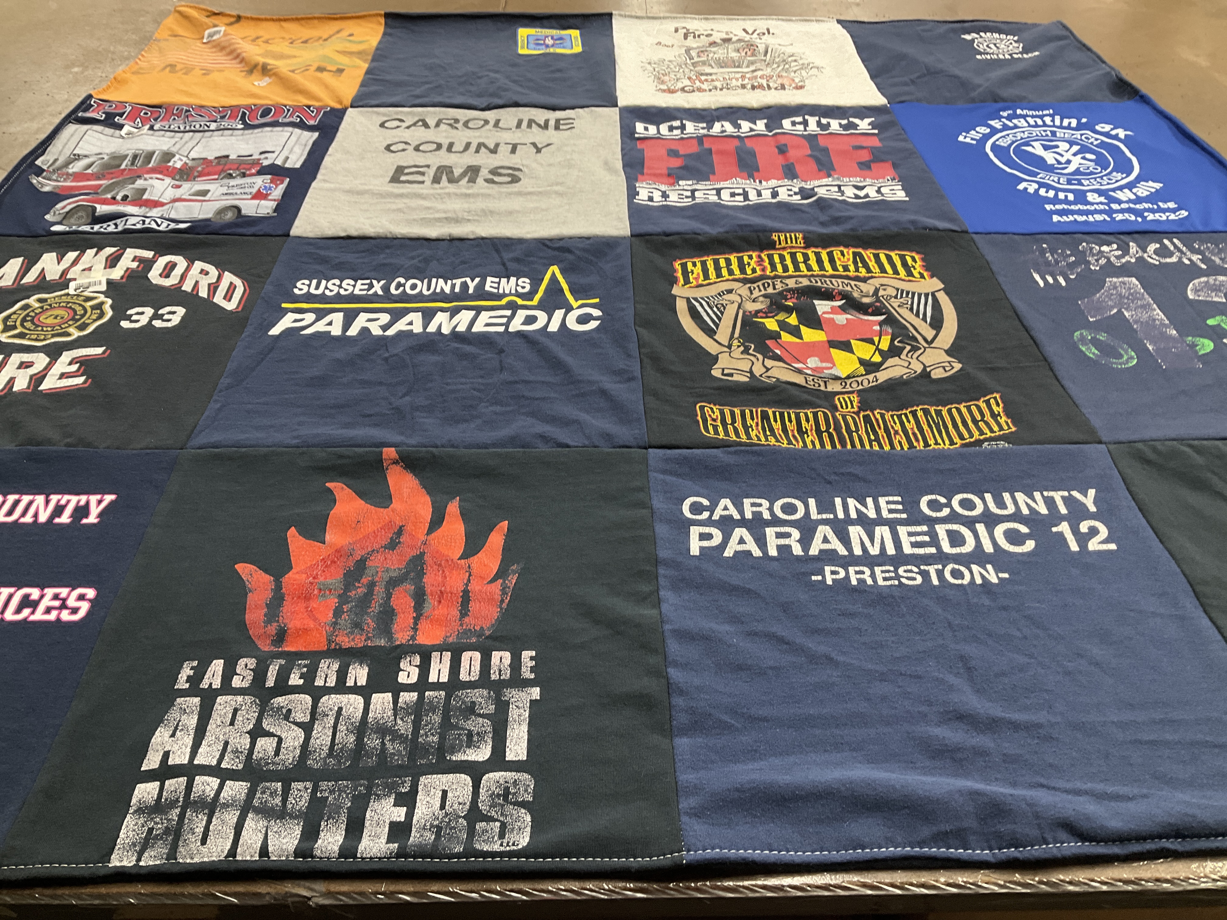 T-shirt quilt with firefighting, emergency services themes by Julie from DE