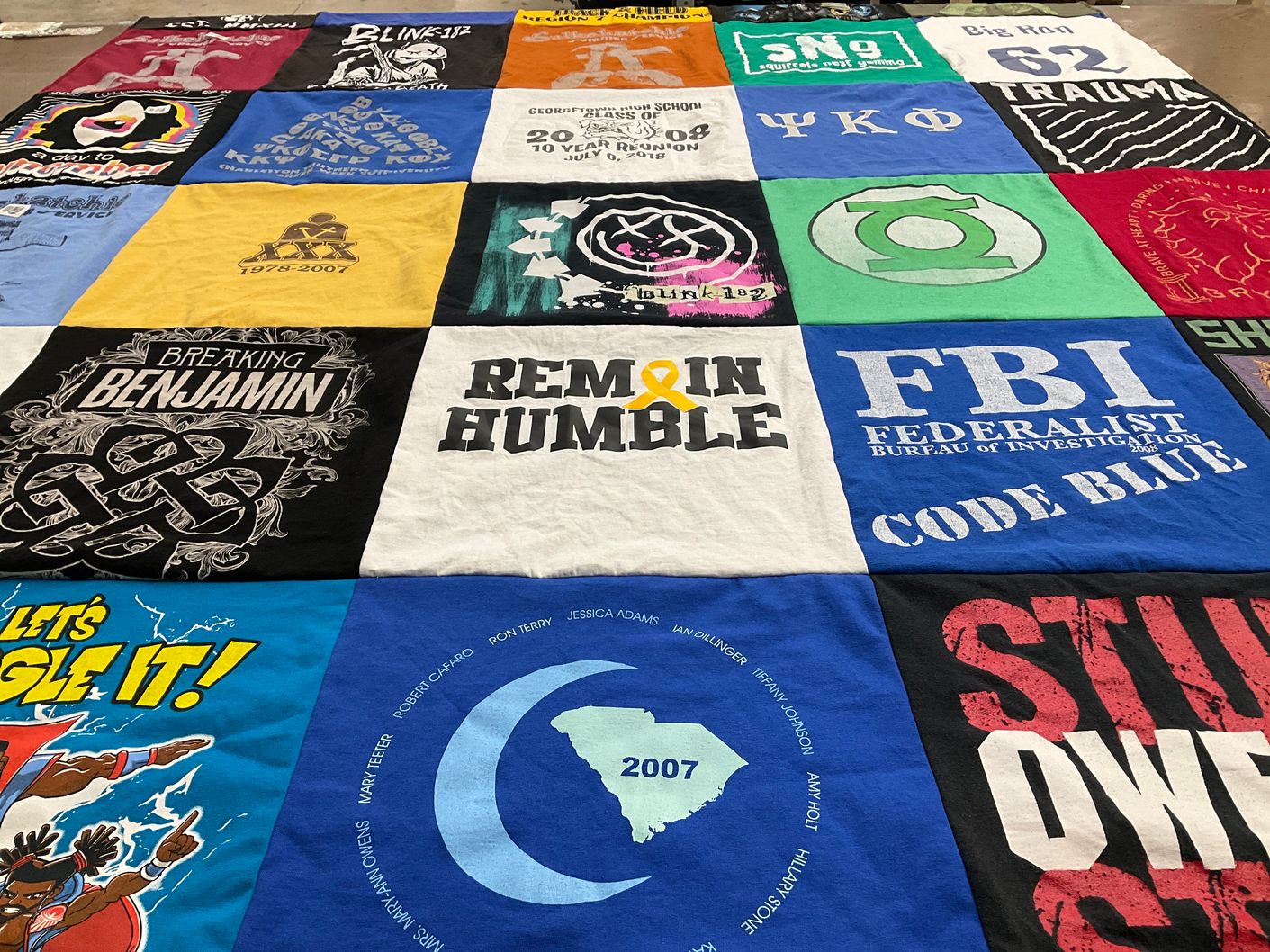 T-shirt quilt with music, law enforcement themes by Eliza from VA