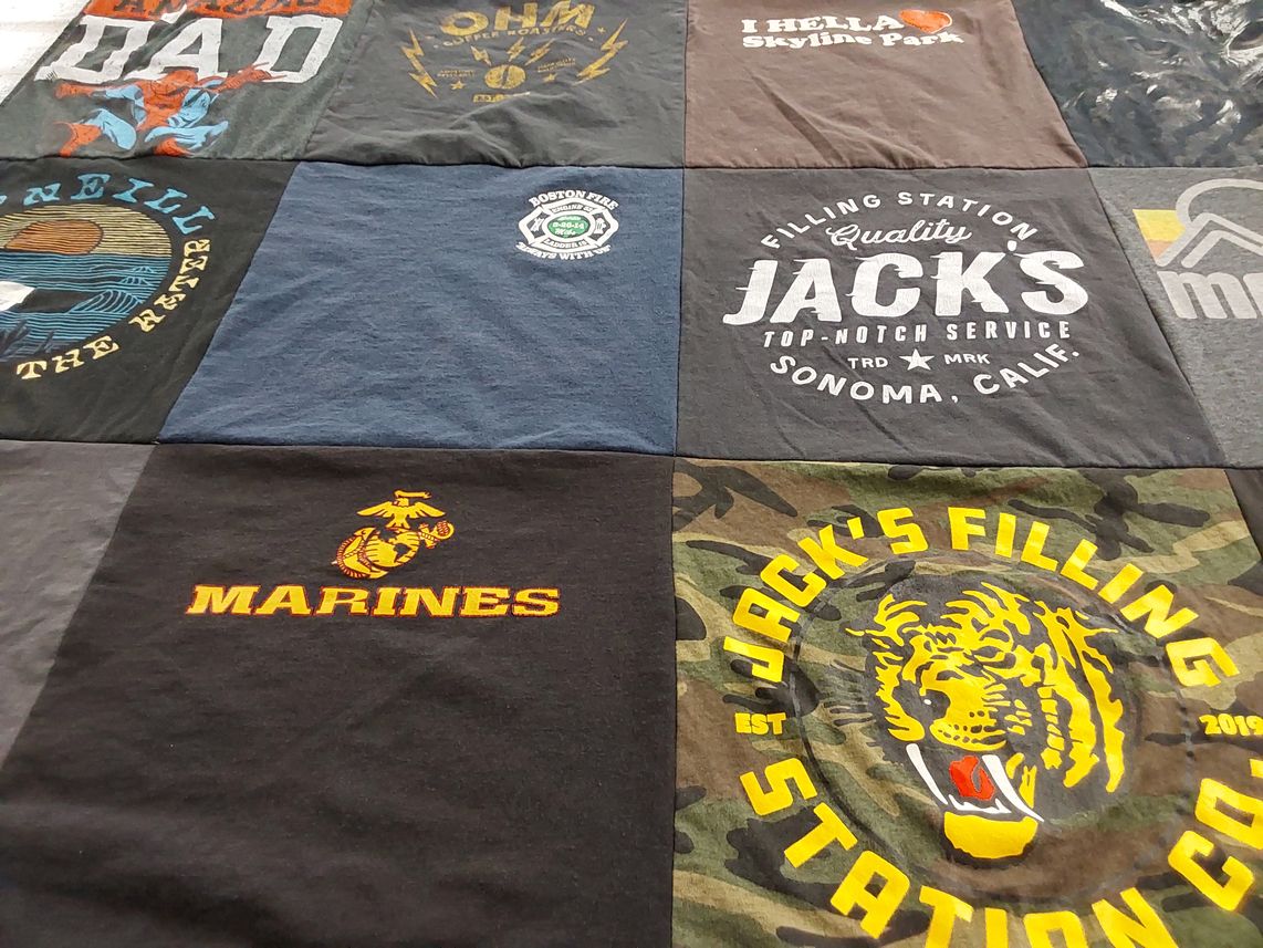 T-shirt quilt with military, firefighting themes by Aleta from CA