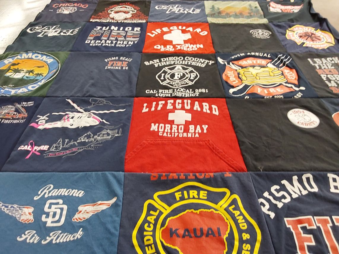 T-shirt quilt with firefighting, lifeguarding themes by Kimberly from CA