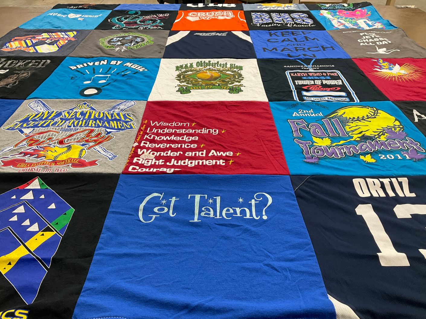 T-shirt quilt with sports, music themes by Diana from TX