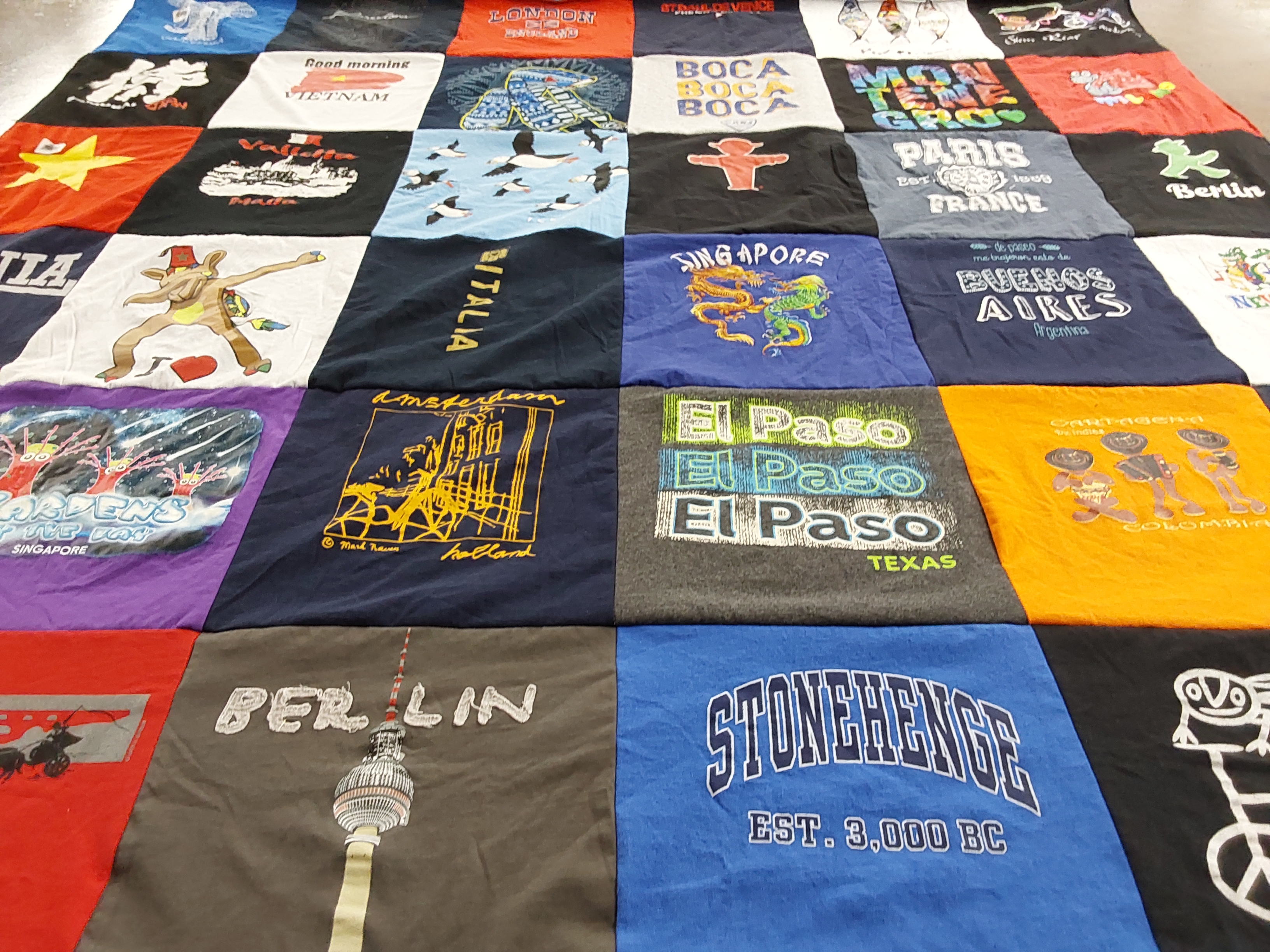 T-shirt quilt with travel, history themes by Lesley from CA