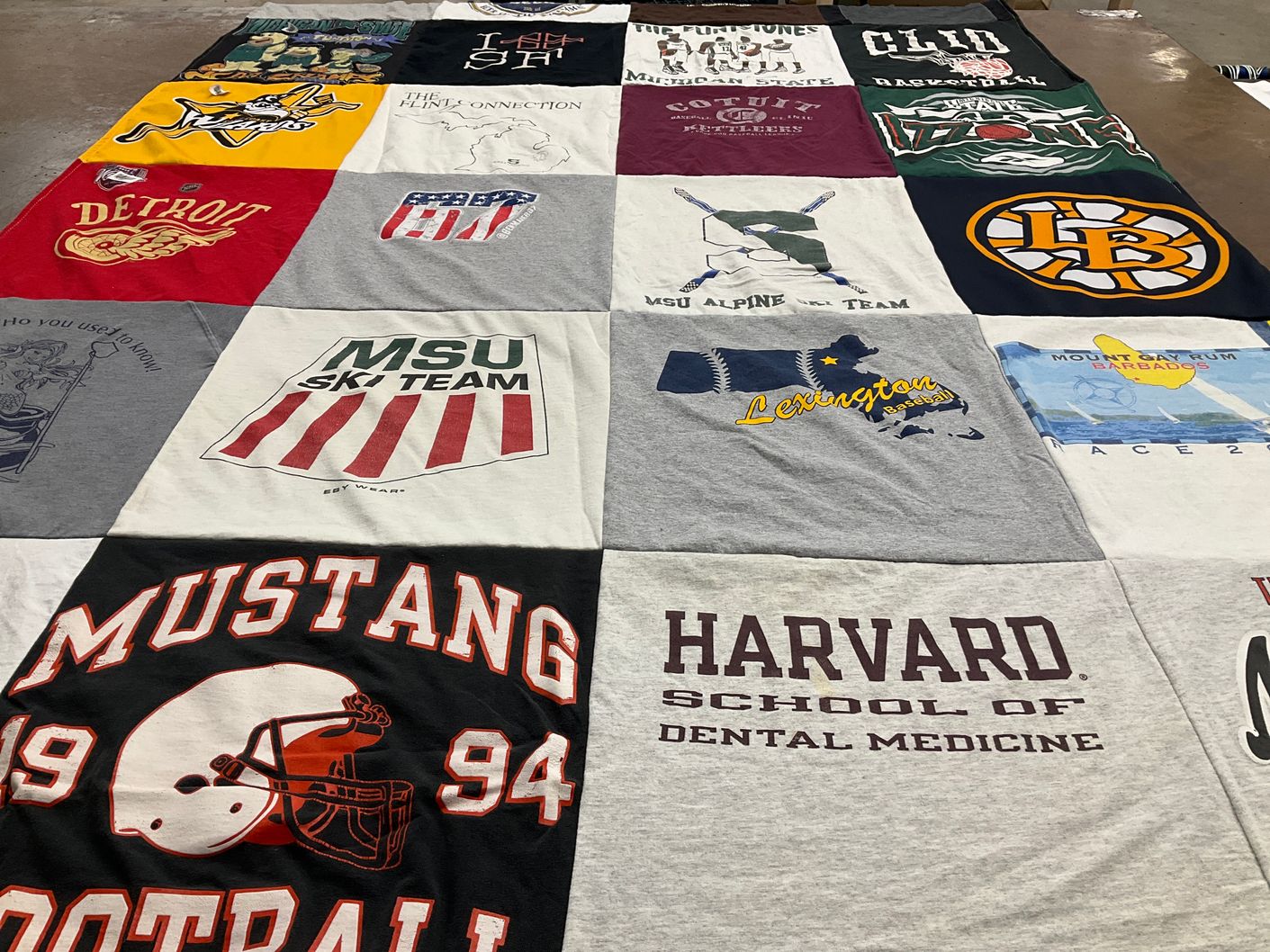 T-shirt quilt featuring mustang football, msu ski team by Carolyn from MA