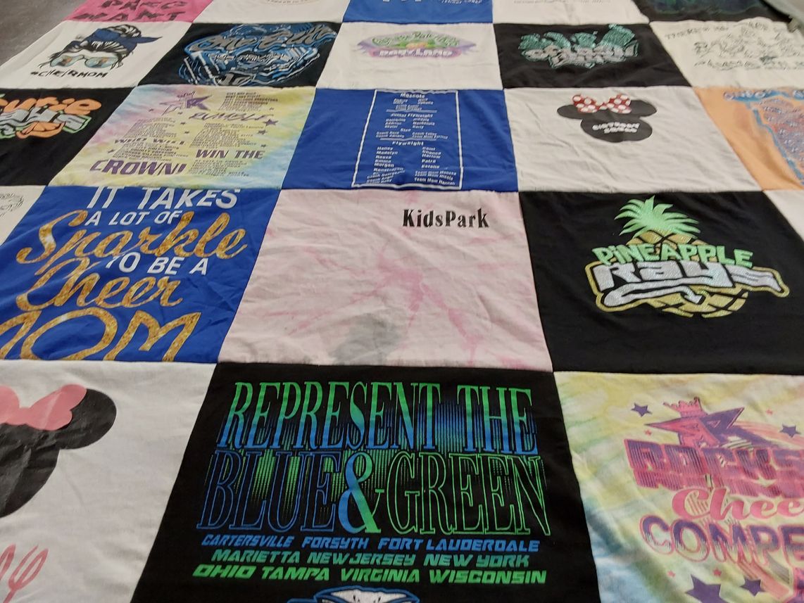 T-shirt quilt with cheerleading, family themes by Jason from FL