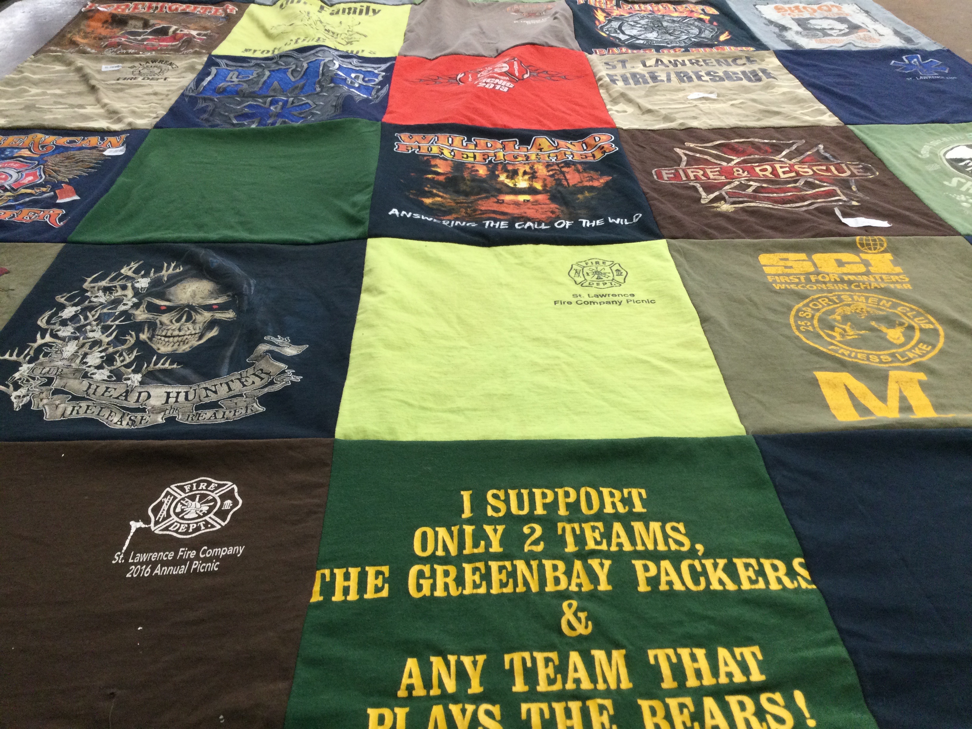 T-shirt quilt with firefighting, hunting themes by Becky from WI