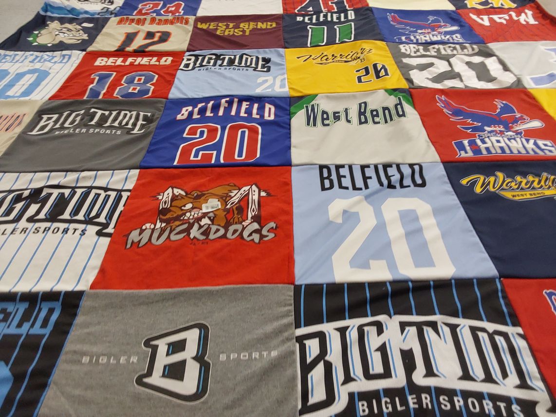T-shirt quilt featuring belfield muckdogs, west bend warriors by Jenny from WI