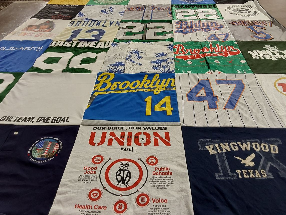 T-shirt quilt with community, activism themes by Nancy from NY