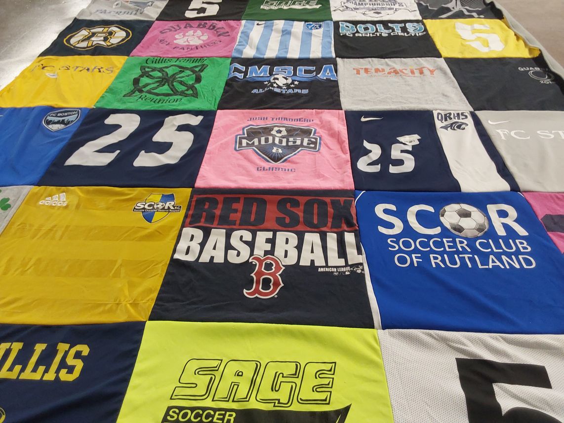 T-shirt quilt with soccer, baseball themes by Nadine from MA