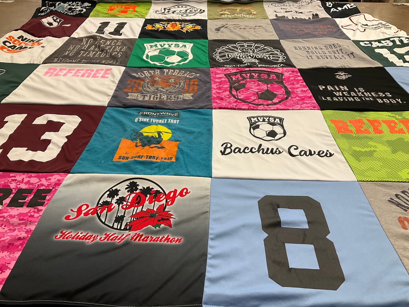 T-shirt quilt with sports, running themes by Helen from TX
