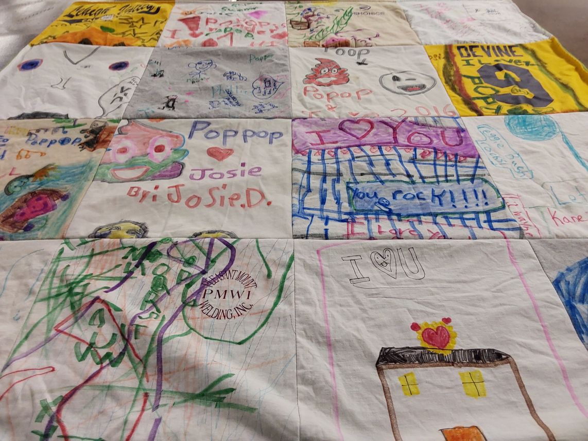 T-shirt quilt with family, art themes by Rosanne from PA