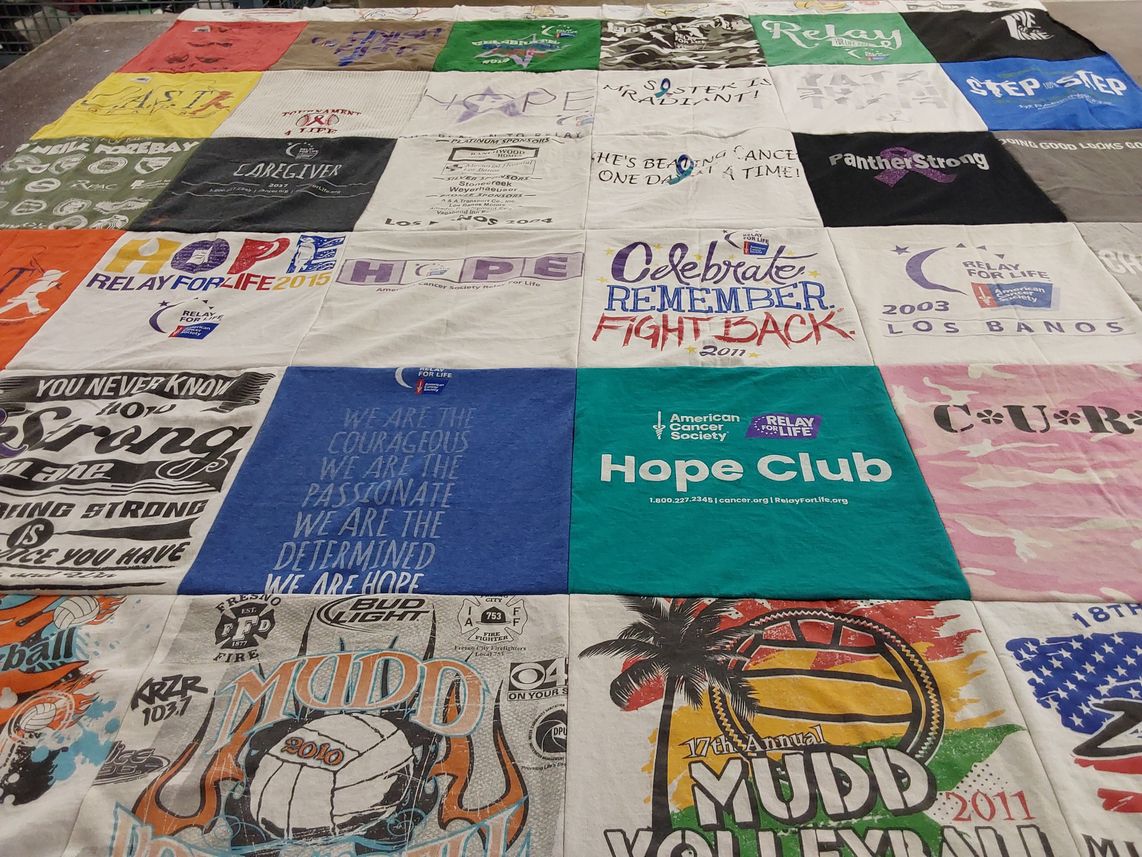 T-shirt quilt with cancer awareness, sports events themes by Melissa from CA