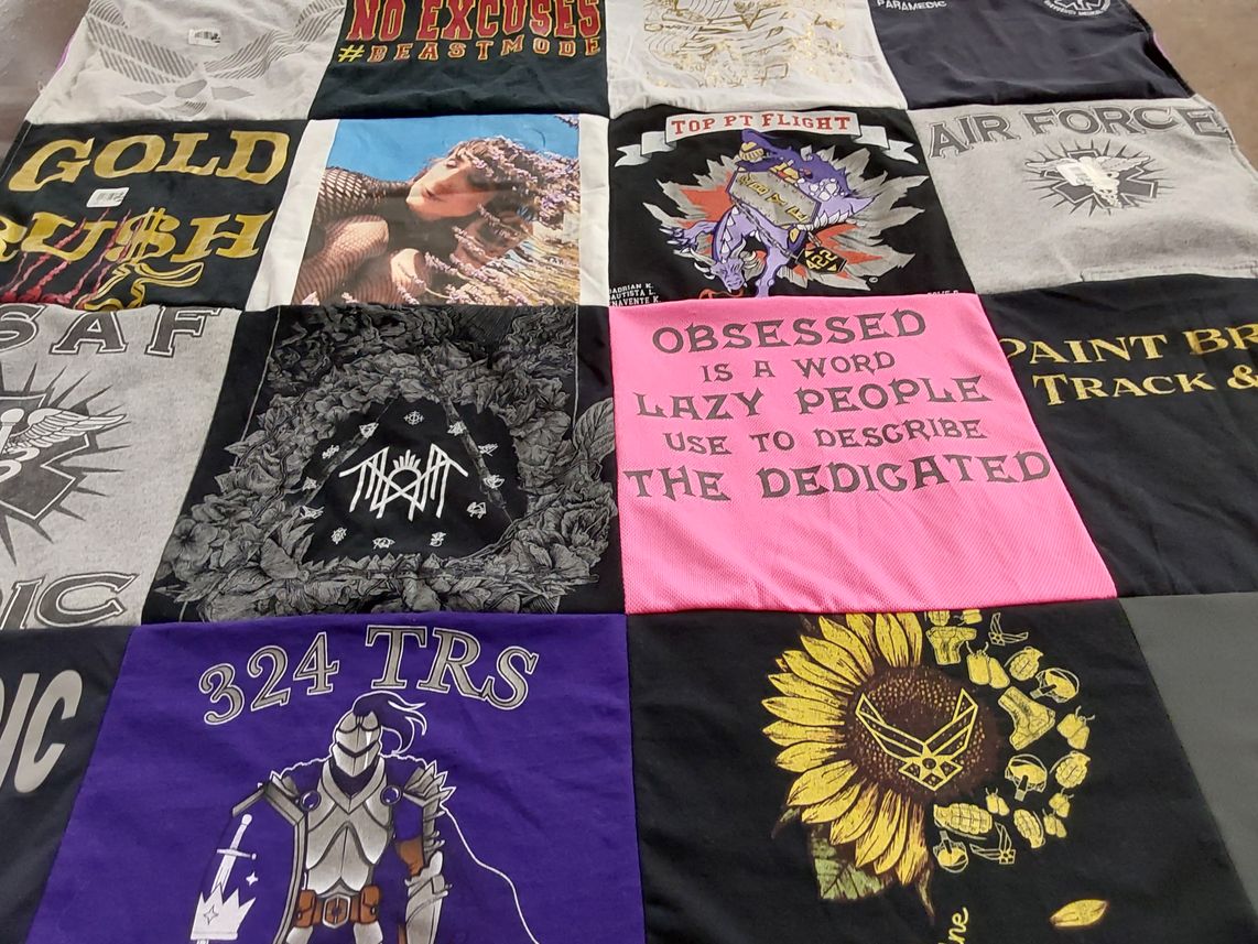 T-shirt quilt with fitness, military themes by Sue from MD
