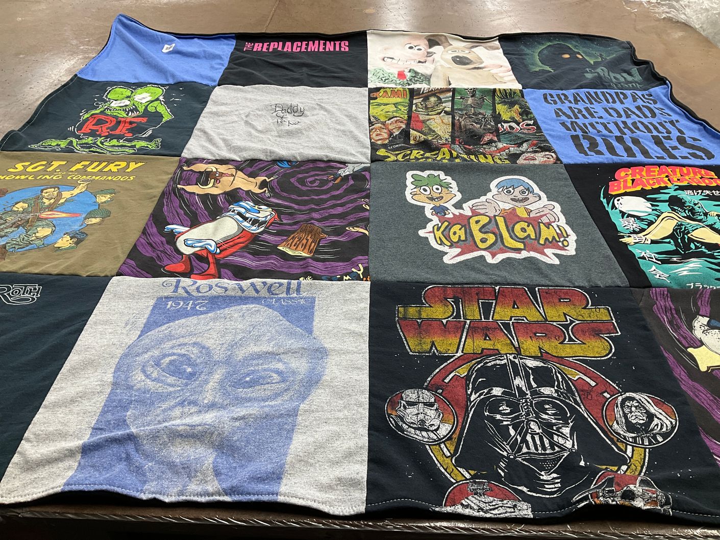 T-shirt quilt with comics, sci-fi themes by Kathy from NY