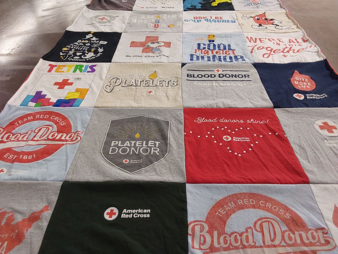 T-shirt quilt with blood donation, healthcare themes by Joy from NC