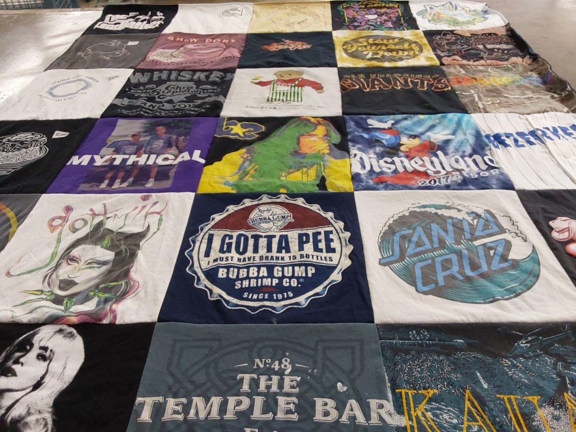 T-shirt quilt with business, travel themes by Shaw from CA