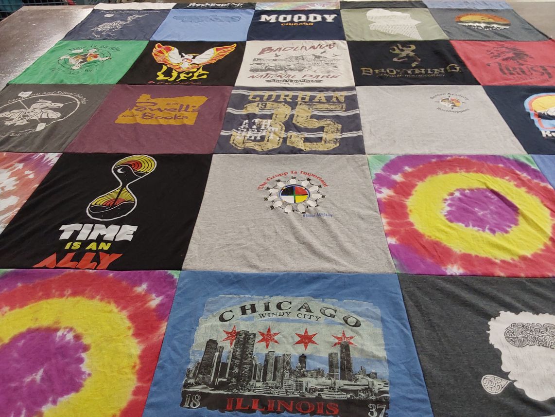 T-shirt quilt with art, music themes by Ms from WA