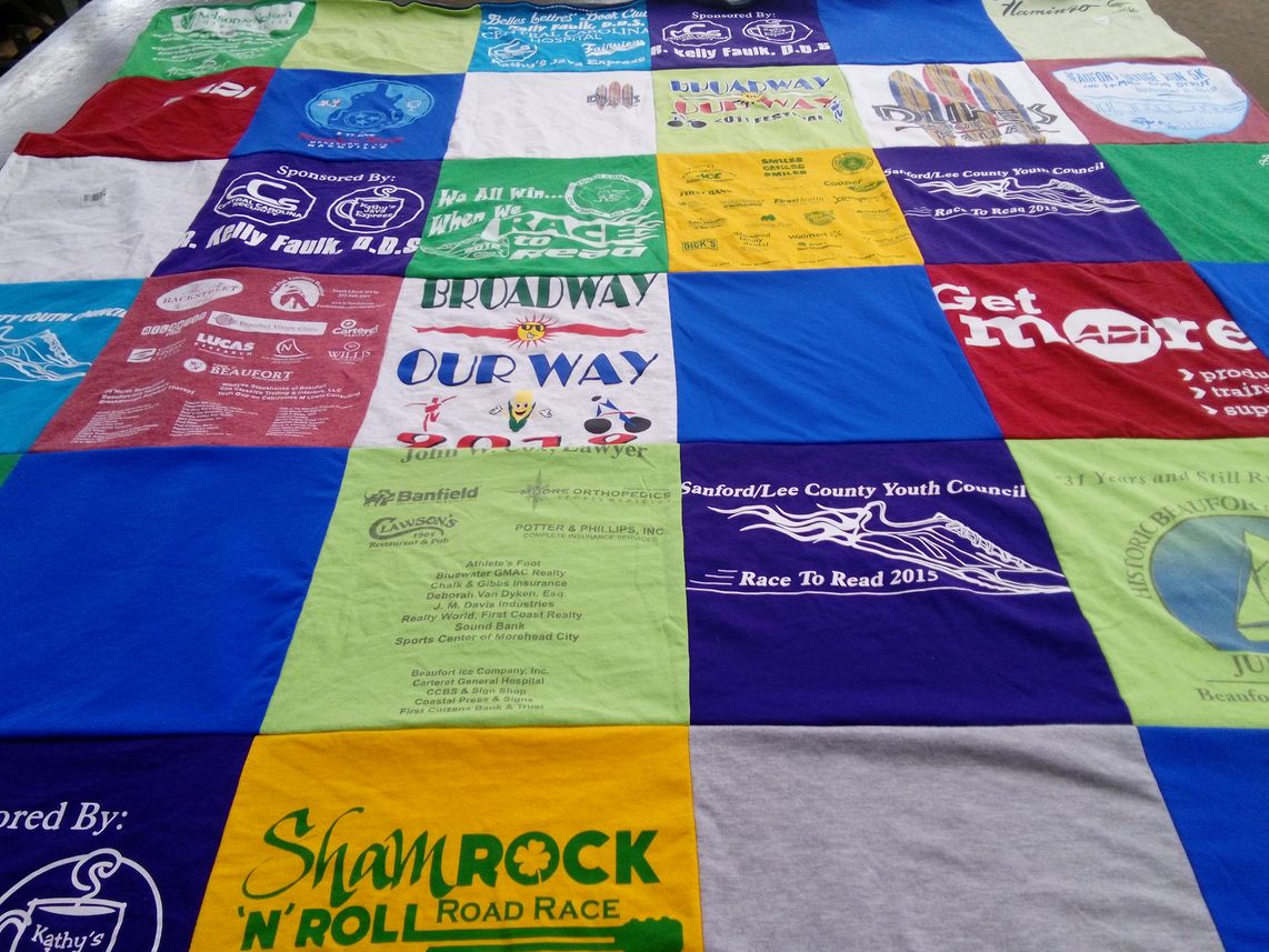 T-shirt quilt with community events, running themes by Nelson from NC