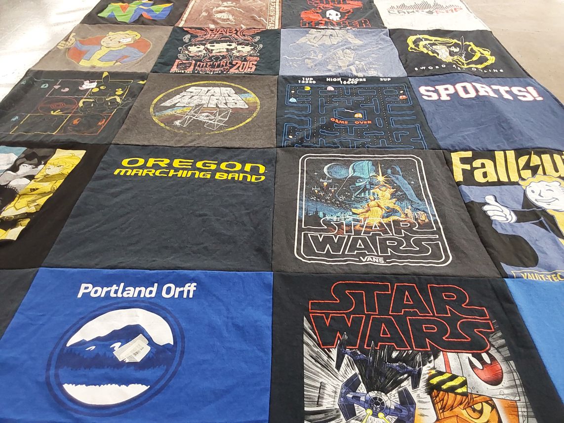 T-shirt quilt with music, gaming themes by Michael from OR