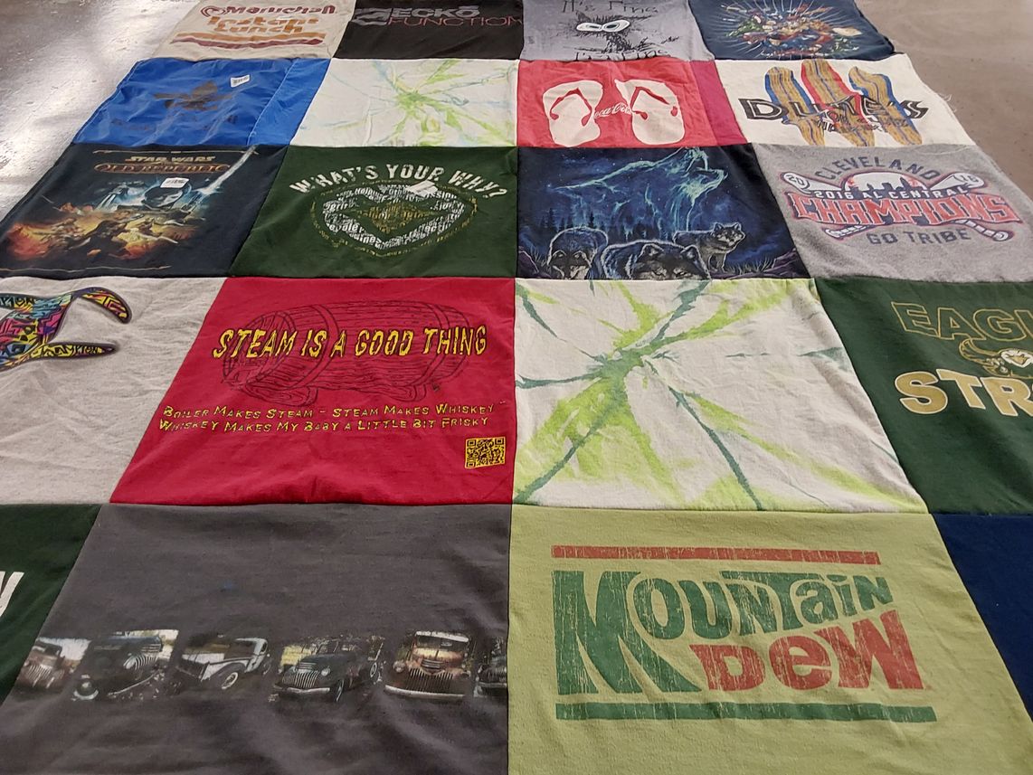 T-shirt quilt with sports, whiskey themes by Ann from OH
