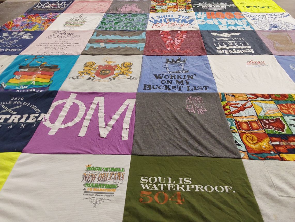 T-shirt quilt with hiking, travel themes by Sara from IL